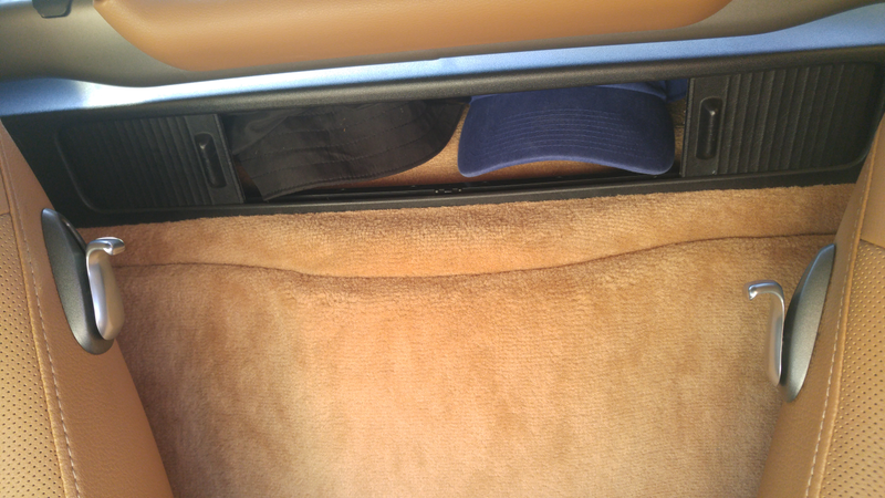 Behind driver: Hat storage shelf